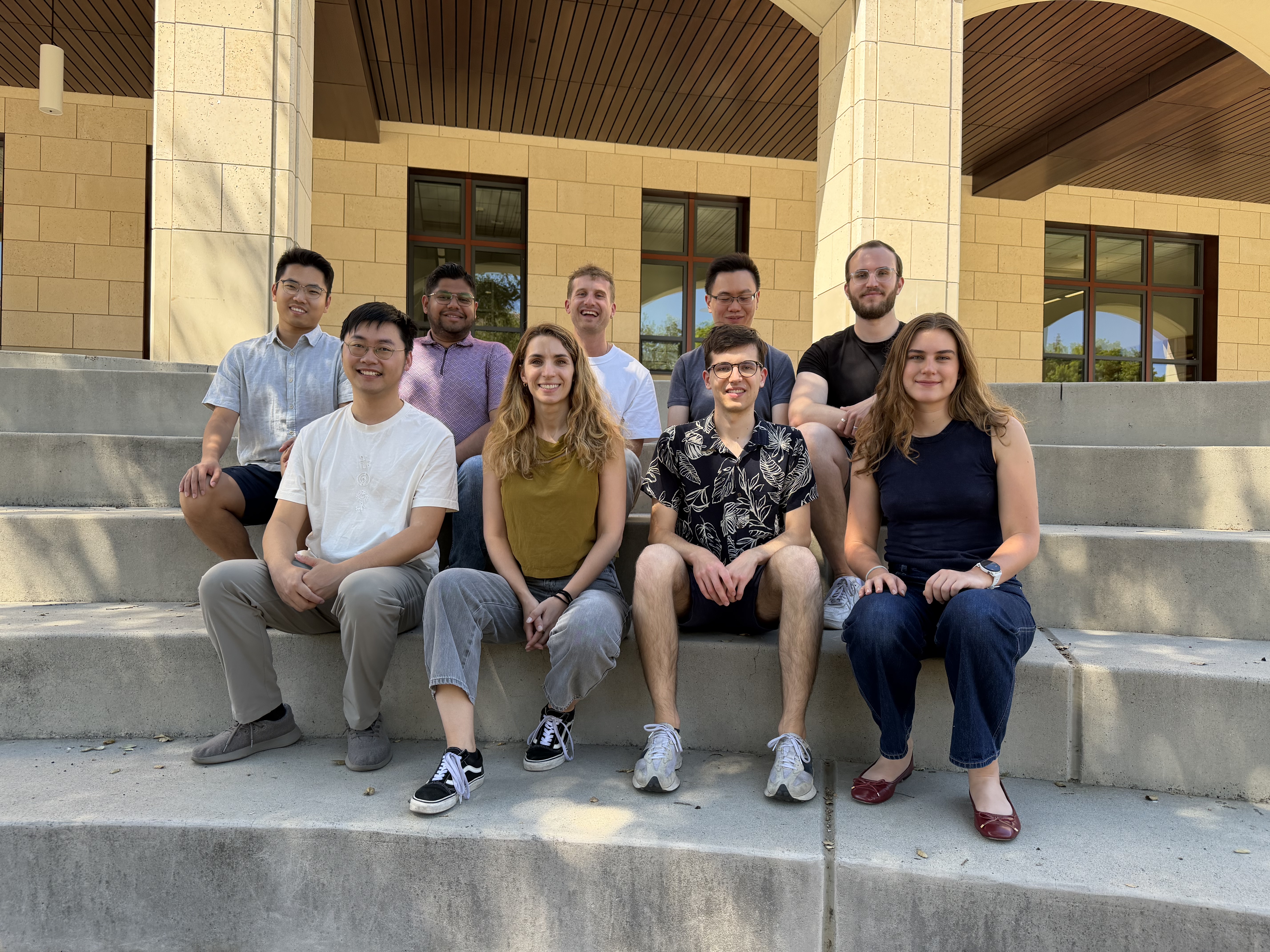 The Gradient Spaces group members sitting outdoors at the Stanford campus.